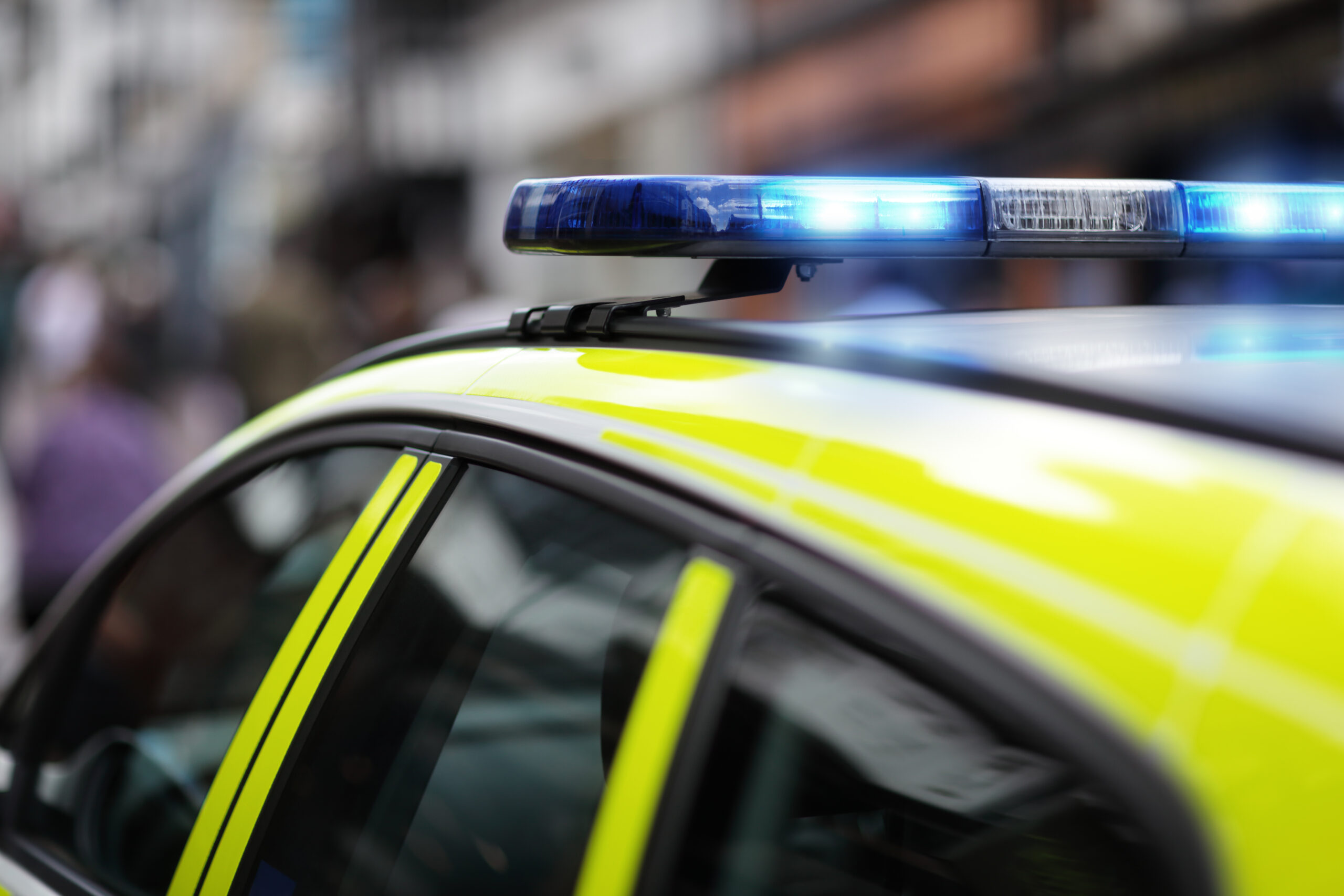 Blue flashing lights of UK police car